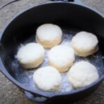 Six scones in a Dutch oven ready to be cooked.