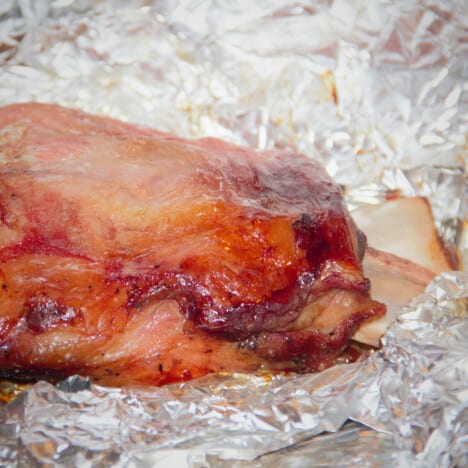 Full lamb shoulder in foil after being cooked but yet to be pulled.