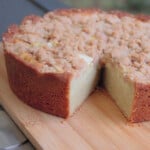 The round apple streusel pound cake with one slice cut out of it.