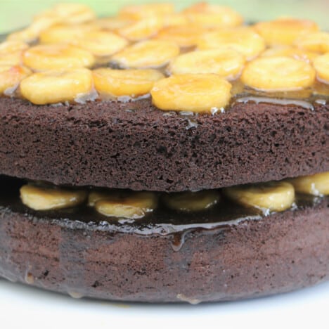 Two layers of chocolate cake covered with the bananas foster filling.