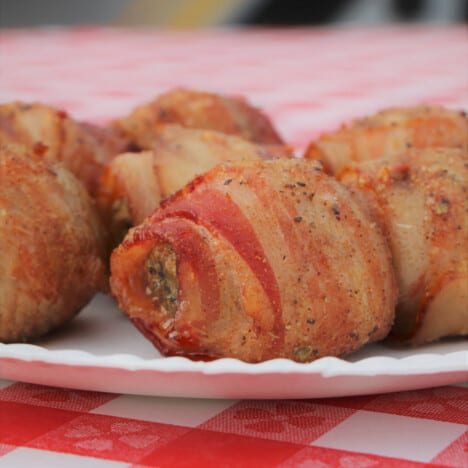 Cooked Moink balls sitting on a serving plate ready to be eaten.