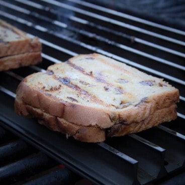 A peanut butter and jelly sandwich on the grill.