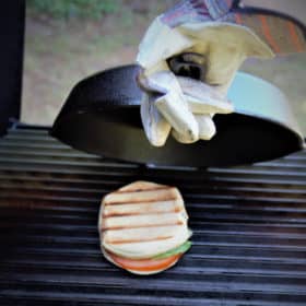 Caprese Panini cooked on a grill requires a little bit of technique but once you get it, cooking perfectly melted and toasted sandwiches is possible. #bushcooking #panini #sandwich #caprese