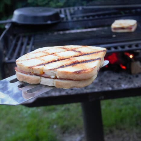 Toasted ham and cheese sandwich that has been taken off the grill.