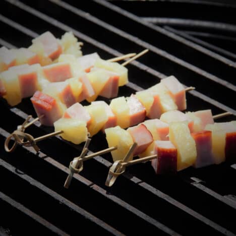 Ham and pineapple kebabs on the grill.