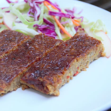 Chickpea loaf is served with slaw and ready to be enjoyed.