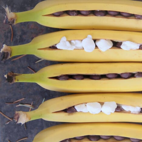Bananas lined up and packed with chocolate and marshmallows awaiting the campfire.