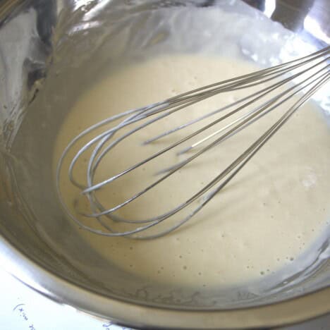 Whisk in a bowl of pancake mixture.