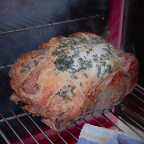 A smoked prime rib roast being checked part way through the cooking process.