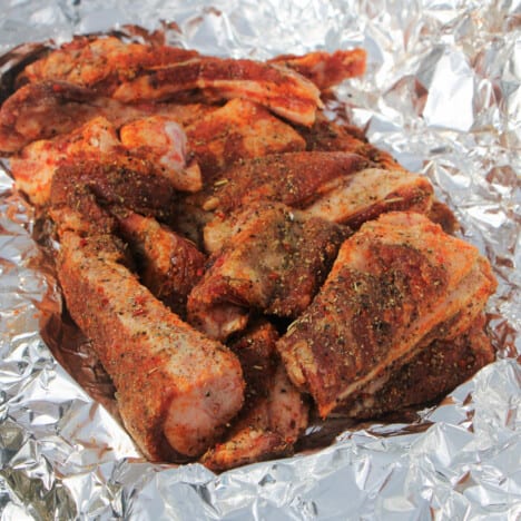 Moist rub-covered lamb ribs sitting in foil.
