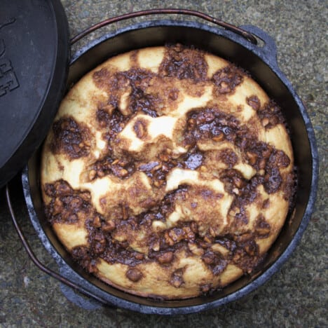 Looking down on a cooked sour cream coffee cake in a Dutch oven.