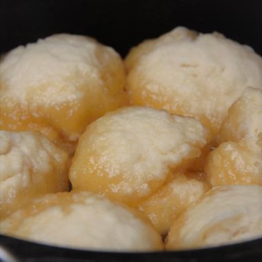 Golden Syrup Dumplings close up in a Dutch oven