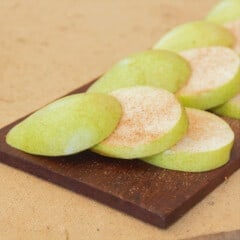 Plank Pears are sliced and laid out decoratively on a plank ready to cook.