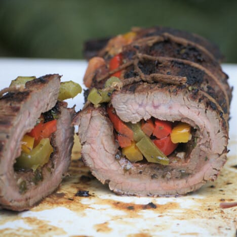 The fajita roll up is sliced in two exposing the colorful bell pepper filling.