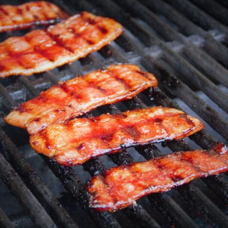 Thinly sliced pork belly is cooked on a grill then glazed.