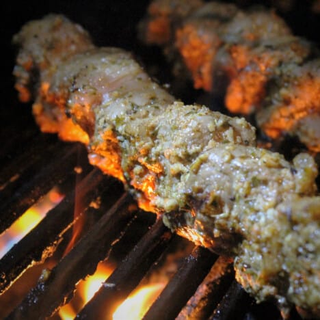 Lamb Souvlaki is grilling on the barbecue.