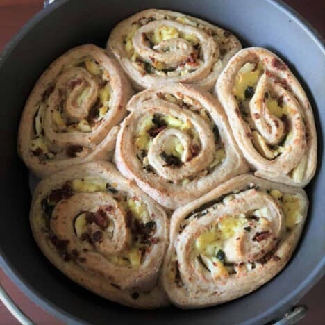 Cooked Jalapeño Popper Rolls sitting in the Dutch oven.