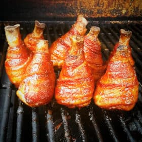 Bacon Wrapped Chicken Legs undergoing their second cook after being glazed.