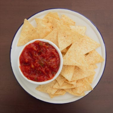 Areal shot of chips and salsa dip