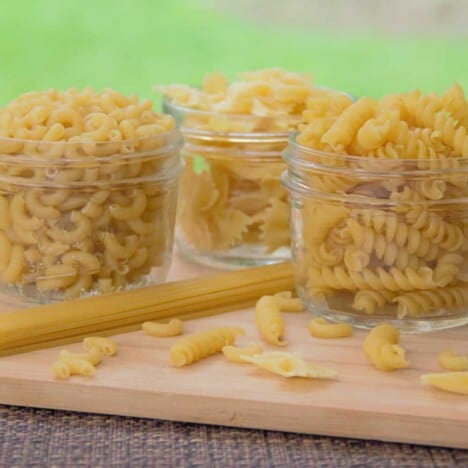 Different types of dried pasta in jars