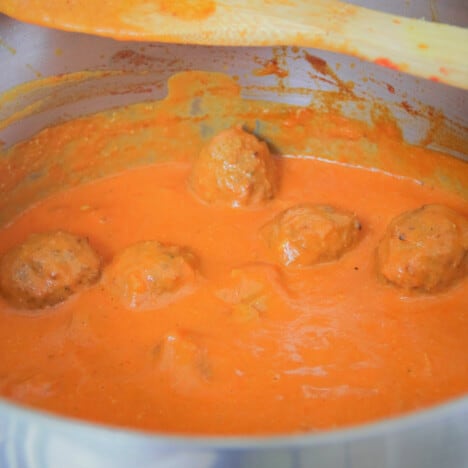 Looking into a very saucy saucepan of Indian Meatball Tikka Masala Curry.