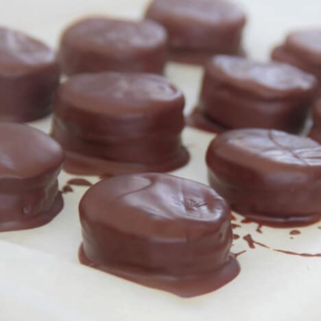 Recently chocolate coated peppermint creams sitting on baking paper waiting to set.