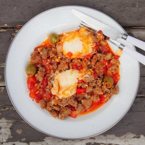 Shakshuka served on a camp plate ready to be eaten.