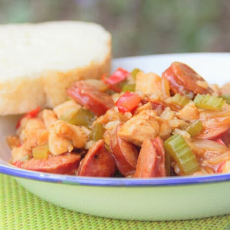 A camp plate with a serving of the Camp Mock Jambalaya with a thick slice of bread on the side.
