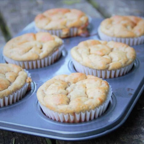 A 6-hole muffing tray with light brown breakfast bites.