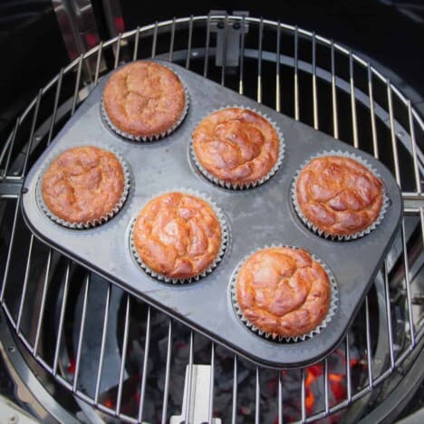 Looking down into an Aquoforno that has a 6-hole muffin tray filled with golden brown banana breakfast bites.