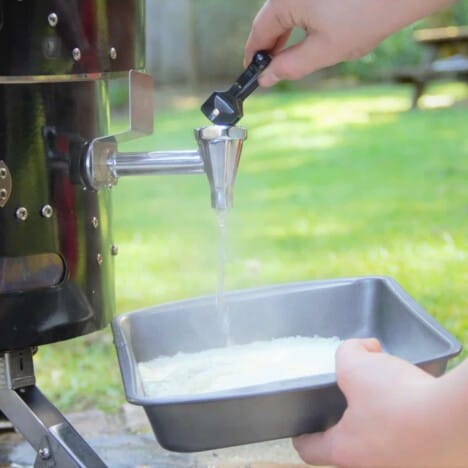 Water being added to a tray of dehydrated mashed potatoes.