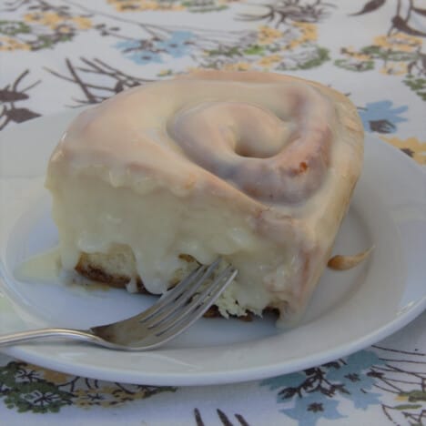 The five spice sweet roll served on a white plate with a fork.
