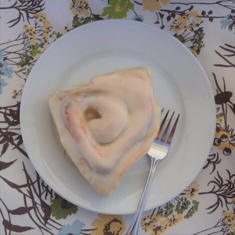 Looking down on a small plate with a five spice sweet roll.