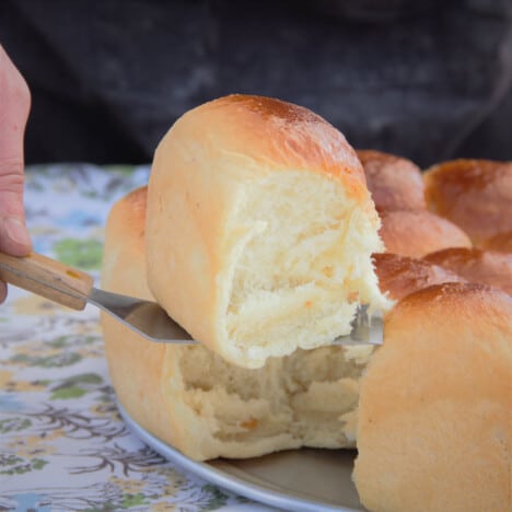 The first roll being removed from the batch bake.