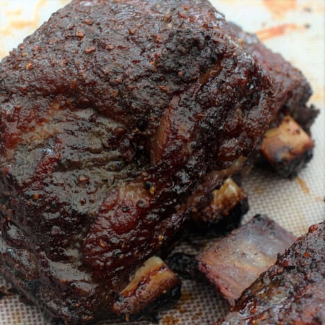 A close up of glazed smoked short ribs.