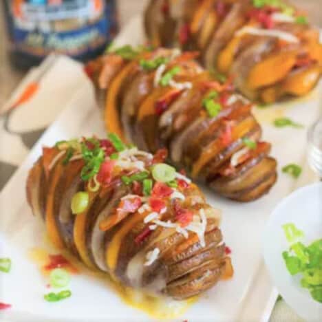 Close up of cheese stuffed Hassleback prepared potaoes ready to be served.